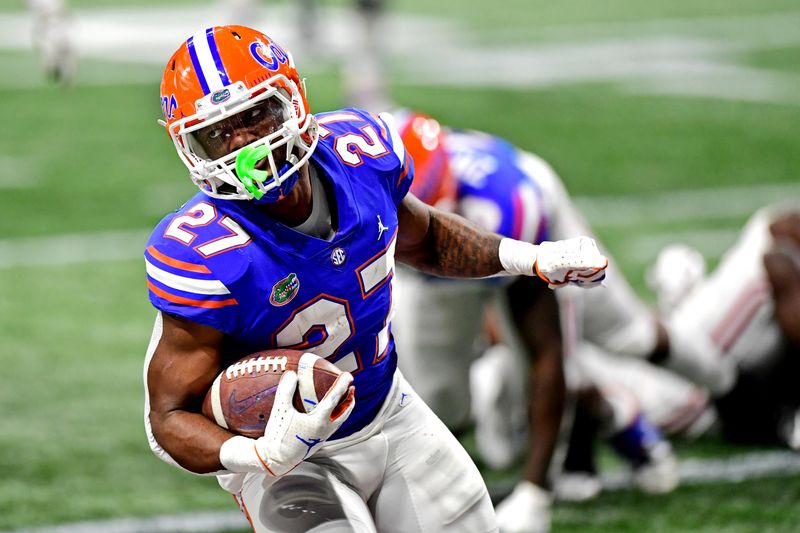 Dec 19, 2020; Atlanta, Georgia, USA; Florida Gators running back Dameon Pierce (27) runs for a touchdown during the fourth quarter in the SEC Championship at Mercedes-Benz Stadium. Mandatory Credit: Adam Hagy-USA TODAY Sports