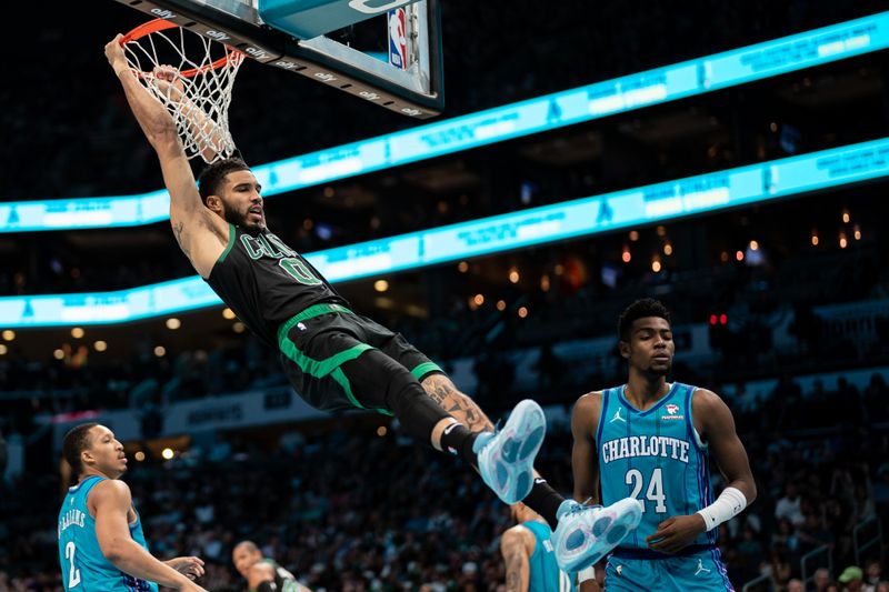 CHARLOTTE, NORTH CAROLINA - APRIL 01: Jayson Tatum #0 of the Boston Celtics dunks the ball in the third quarter during their game against the Charlotte Hornets at Spectrum Center on April 01, 2024 in Charlotte, North Carolina. NOTE TO USER: User expressly acknowledges and agrees that, by downloading and or using this photograph, User is consenting to the terms and conditions of the Getty Images License Agreement. (Photo by Jacob Kupferman/Getty Images)