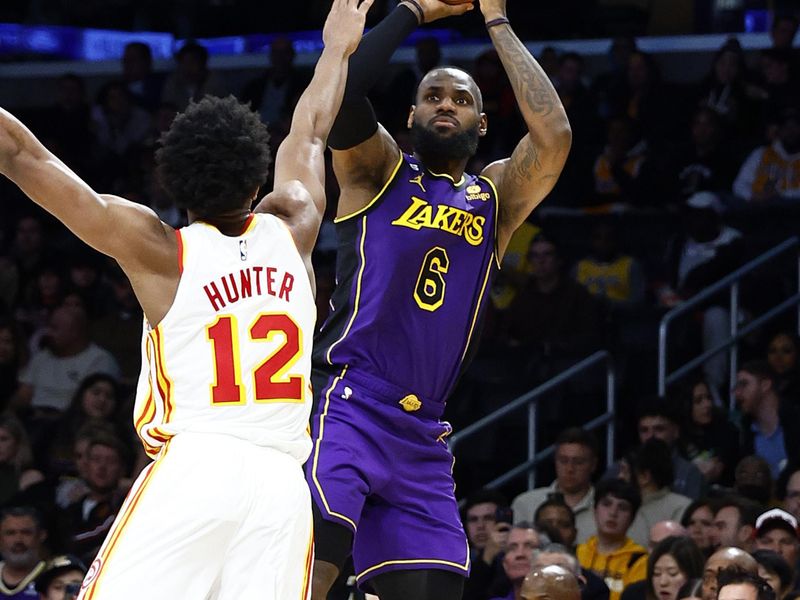 LOS ANGELES, CALIFORNIA - JANUARY 06:  LeBron James #6 of the Los Angeles Lakers takes a shot against De'Andre Hunter #12 of the Atlanta Hawks in the second half at Crypto.com Arena on January 06, 2023 in Los Angeles, California.  NOTE TO USER: User expressly acknowledges and agrees that, by downloading and/or using this photograph, user is consenting to the terms and conditions of the Getty Images License Agreement.  (Photo by Ronald Martinez/Getty Images)