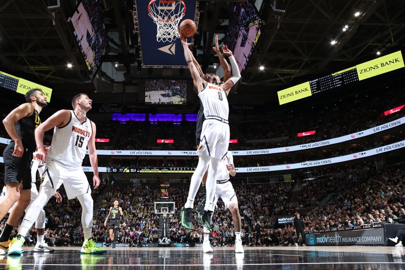 SALT LAKE CITY, UT - APRIL 9: Peyton Watson #8 of the Denver Nuggets grabs the rebound during the game against the Utah Jazz on April 9, 2024 at Delta Center in Salt Lake City, Utah. NOTE TO USER: User expressly acknowledges and agrees that, by downloading and or using this Photograph, User is consenting to the terms and conditions of the Getty Images License Agreement. Mandatory Copyright Notice: Copyright 2024 NBAE (Photo by Melissa Majchrzak/NBAE via Getty Images)