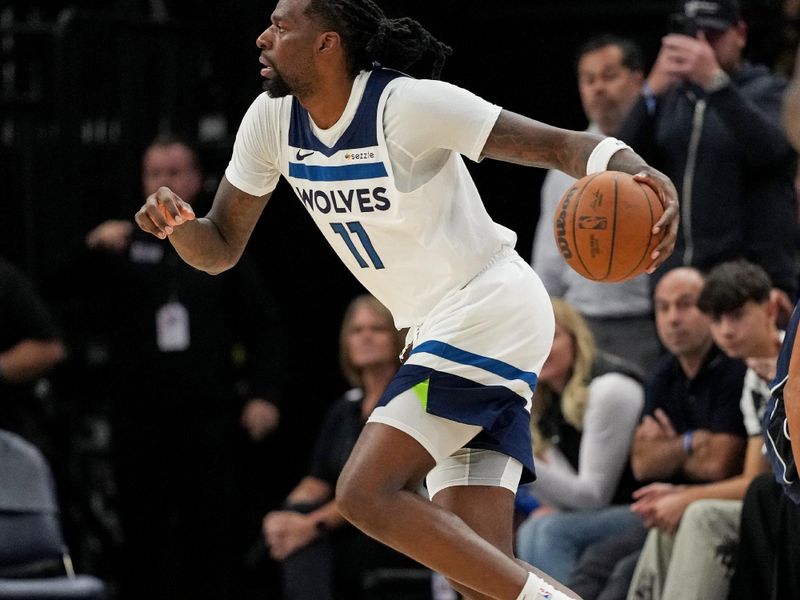 MINNEAPOLIS, MN -  OCTOBER 29: Naz Reid #11 of the Minnesota Timberwolves dribbles the ball during the game against the Dallas Mavericks on October 29, 2024 at Target Center in Minneapolis, Minnesota. NOTE TO USER: User expressly acknowledges and agrees that, by downloading and or using this Photograph, user is consenting to the terms and conditions of the Getty Images License Agreement. Mandatory Copyright Notice: Copyright 2024 NBAE (Photo by Jordan Johnson/NBAE via Getty Images)