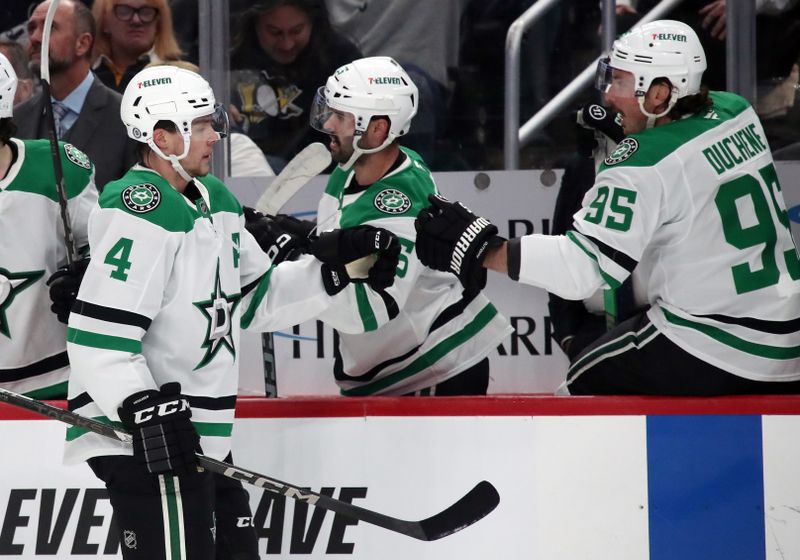 Nov 11, 2024; Pittsburgh, Pennsylvania, USA;  Dallas Stars defenseman Miro Heiskanen (4) celebrates his goal with the Dallas Stars bench against the Pittsburgh Penguins during the first period at PPG Paints Arena. Mandatory Credit: Charles LeClaire-Imagn Images
