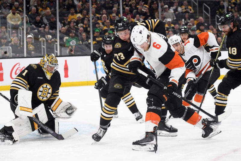 Mar 16, 2024; Boston, Massachusetts, USA; Boston Bruins defenseman Charlie McAvoy (73) and Philadelphia Flyers defenseman Travis Sanheim (6) battle for the puck during the second period at TD Garden. Mandatory Credit: Bob DeChiara-USA TODAY Sports