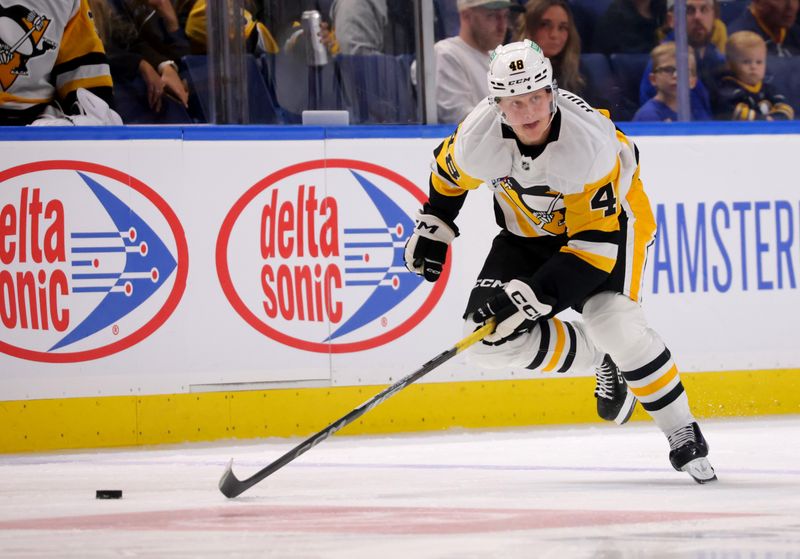 Sep 21, 2024; Buffalo, New York, USA;  Pittsburgh Penguins right wing Valtteri Puustinen (48) carries the puck up ice during the first period against the Buffalo Sabres at KeyBank Center. Mandatory Credit: Timothy T. Ludwig-Imagn Images