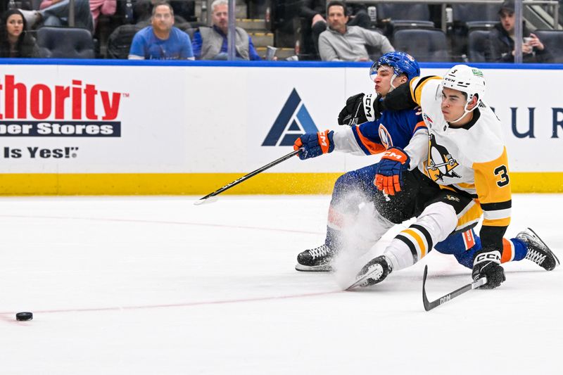 Apr 17, 2024; Elmont, New York, USA;  Pittsburgh Penguins defenseman Jack St. Ivany (3) is called for a penalty on New York Islanders center Ruslan Iskhakov (37) during the second period at UBS Arena. Mandatory Credit: Dennis Schneidler-USA TODAY Sports