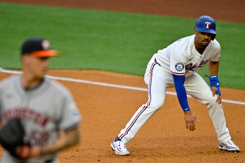 Apr 5, 2024; Arlington, Texas, USA; Houston Astros pitcher Seth Martinez (61) pitches against the Texas Rangers as second base Marcus Semien (2) looks on from the base path during the first inning at Globe Life Field. Mandatory Credit: Jerome Miron-USA TODAY Sports