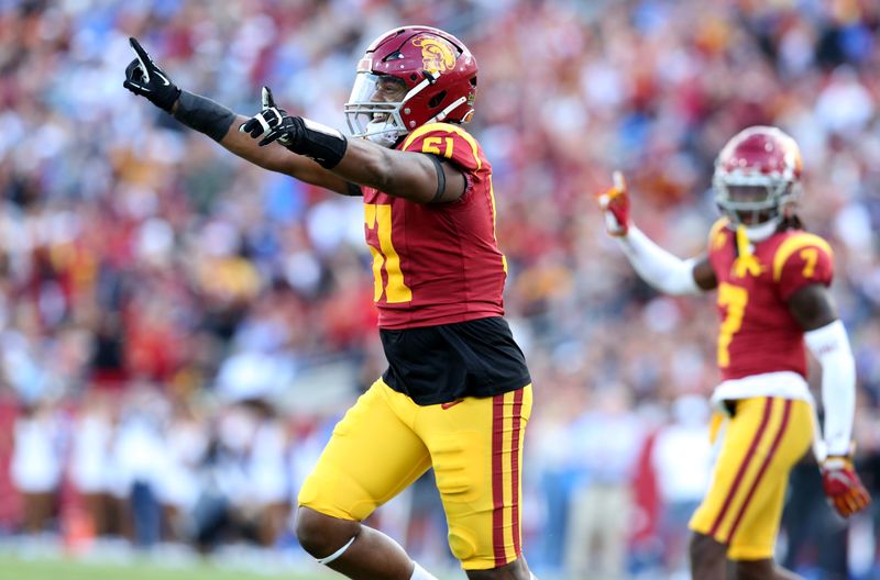 Nov 18, 2023; Los Angeles, California, USA; USC Trojans defensive end Solomon Byrd (51) celebrates after a missed field goal during the second quarter against the UCLA Bruins at United Airlines Field at Los Angeles Memorial Coliseum. Mandatory Credit: Jason Parkhurst-USA TODAY Sports