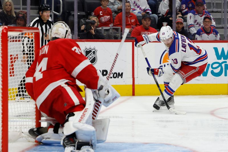 Oct 17, 2024; Detroit, Michigan, USA;  New York Rangers left wing Alexis Lafrenière (13) skates with the puck in the third period against the Detroit Red Wings at Little Caesars Arena. Mandatory Credit: Rick Osentoski-Imagn Images