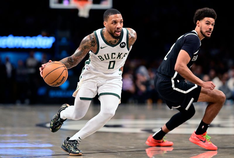 NEW YORK, NEW YORK - DECEMBER 08:  Damian Lillard #0 of the Milwaukee Bucks drives to the basket against Cameron Johnson #2 of the Brooklyn Nets during the first half at Barclays Center on December 08, 2024 in New York City. NOTE TO USER: User expressly acknowledges and agrees that, by downloading and or using this Photograph, user is consenting to the terms and conditions of the Getty Images License Agreement.  (Photo by Steven Ryan/Getty Images)