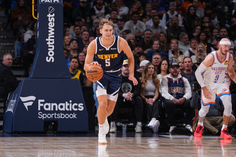 DENVER, CO - NOVEMBER 6: Hunter Tyson #5 of the Denver Nuggets dribbles the ball during the game against the Oklahoma City Thunder during a regular season game on November 6, 2024 at Ball Arena in Denver, Colorado. NOTE TO USER: User expressly acknowledges and agrees that, by downloading and/or using this Photograph, user is consenting to the terms and conditions of the Getty Images License Agreement. Mandatory Copyright Notice: Copyright 2024 NBAE (Photo by Bart Young/NBAE via Getty Images)