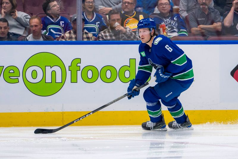 Oct 9, 2024; Vancouver, British Columbia, CAN; Vancouver Canucks forward Brock Boeser (6) handles the puck against the Calgary Flames during the second period at Rogers Arena. Mandatory Credit: Bob Frid-Imagn Images