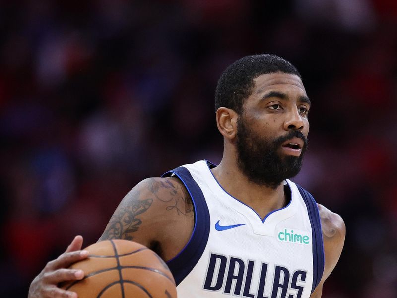 HOUSTON, TEXAS - JANUARY 01: Kyrie Irving #11 of the Dallas Mavericks moves the ball down court against the Houston Rockets during the first half at Toyota Center on January 01, 2025 in Houston, Texas. NOTE TO USER: User expressly acknowledges and agrees that, by downloading and or using this photograph, User is consenting to the terms and conditions of the Getty Images License Agreement. (Photo by Alex Slitz/Getty Images)