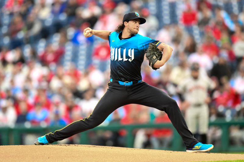 May 3, 2024; Philadelphia, Pennsylvania, USA; Philadelphia Phillies pitcher Aaron Nola (27) pitches during the first inning against the San Francisco Giants at Citizens Bank Park. Mandatory Credit: John Jones-USA TODAY Sports