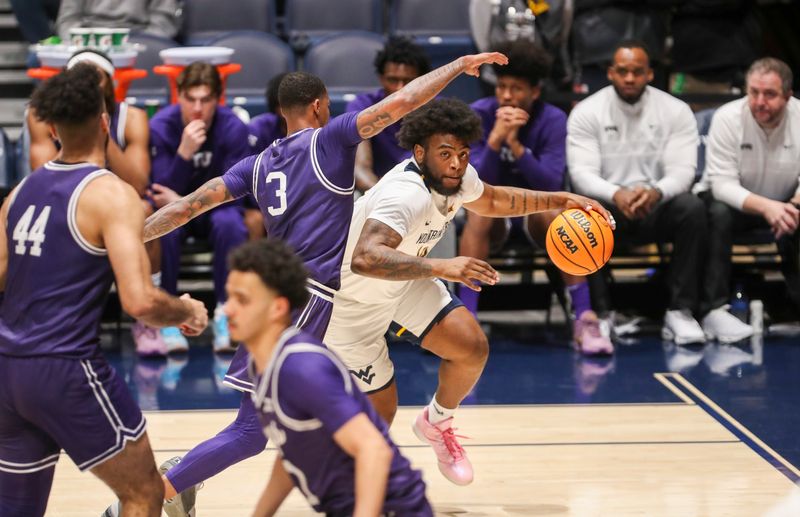 Mar 6, 2024; Morgantown, West Virginia, USA; West Virginia Mountaineers guard Seth Wilson (14) drives baseline against TCU Horned Frogs guard Avery Anderson III (3) during the first half at WVU Coliseum. Mandatory Credit: Ben Queen-USA TODAY Sports