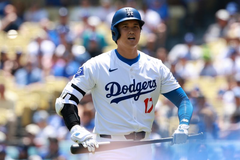 May 8, 2024; Los Angeles, California, USA;  Los Angeles Dodgers designated hitter Shohei Ohtani (17) walks back to the dugout after strike out during the first inning against the Miami Marlins at Dodger Stadium. Mandatory Credit: Kiyoshi Mio-USA TODAY Sports