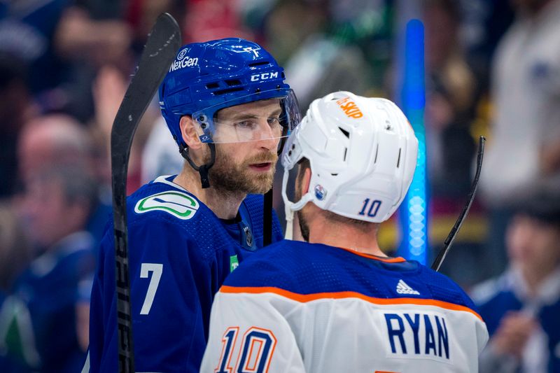 May 20, 2024; Vancouver, British Columbia, CAN; Vancouver Canucks defenseman Carson Soucy (7) shakes hands with Edmonton Oilers forward Derek Ryan (10) after the Edmonton victory in game seven of the second round of the 2024 Stanley Cup Playoffs at Rogers Arena. Mandatory Credit: Bob Frid-USA TODAY Sports