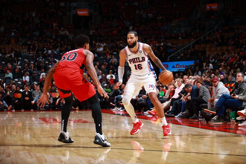 TORONTO, CANADA - OCTOBER 25: Caleb Martin #16 of the Philadelphia 76ers handles the ball during the game against the Toronto Raptors on October 25, 2024 at the Scotiabank Arena in Toronto, Ontario, Canada.  NOTE TO USER: User expressly acknowledges and agrees that, by downloading and or using this Photograph, user is consenting to the terms and conditions of the Getty Images License Agreement.  Mandatory Copyright Notice: Copyright 2024 NBAE (Photo by Vaughn Ridley/NBAE via Getty Images)