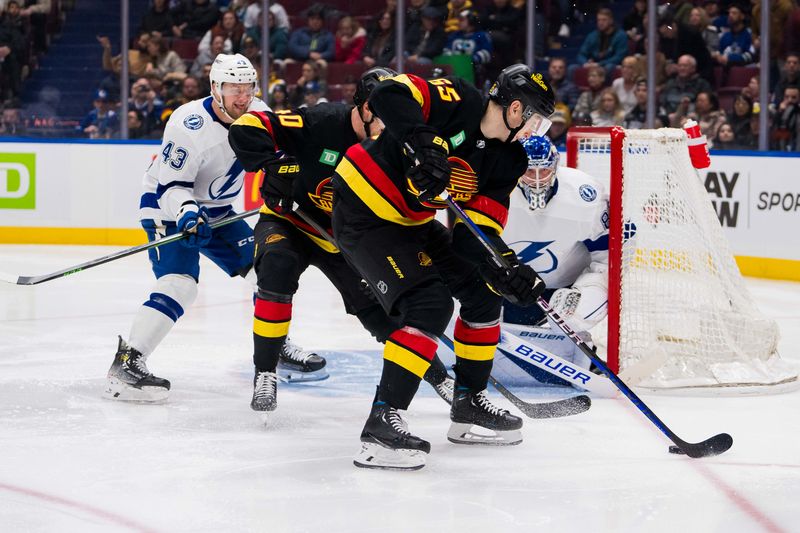 Dec 12, 2023; Vancouver, British Columbia, CAN; Vancouver Canucks forward Ilya Mikheyev (65) handles the puck against the Tampa Bay Lightning in the second period at Rogers Arena. Mandatory Credit: Bob Frid-USA TODAY Sports