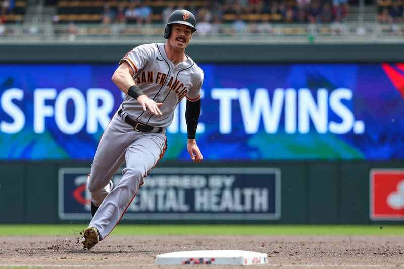 May 24, 2023; Minneapolis, Minnesota, USA; San Francisco Giants center fielder Mike Yastrzemski (5) rounds third base to score on a hit by third baseman Casey Schmitt (not pictured) during the second inning against the Minnesota Twins at Target Field. Mandatory Credit: Matt Krohn-USA TODAY Sports