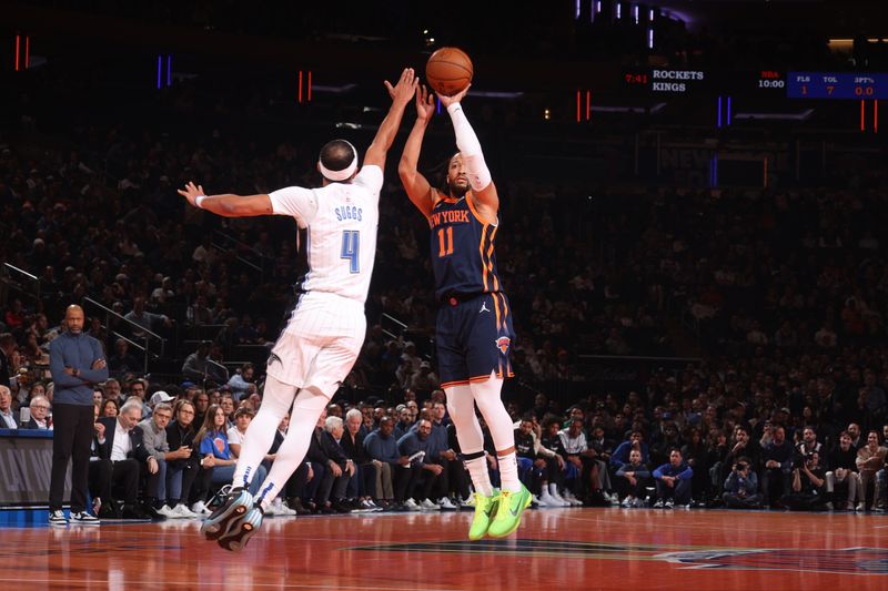 NEW YORK, NY - DECEMBER 3: Jalen Brunson #11 of the New York Knicks shoots a three point basket during the game  against the Orlando Magic during the Emirates NBA Cup on December 3, 2024 at Madison Square Garden in New York City, New York.  NOTE TO USER: User expressly acknowledges and agrees that, by downloading and or using this photograph, User is consenting to the terms and conditions of the Getty Images License Agreement. Mandatory Copyright Notice: Copyright 2024 NBAE  (Photo by Nathaniel S. Butler/NBAE via Getty Images)