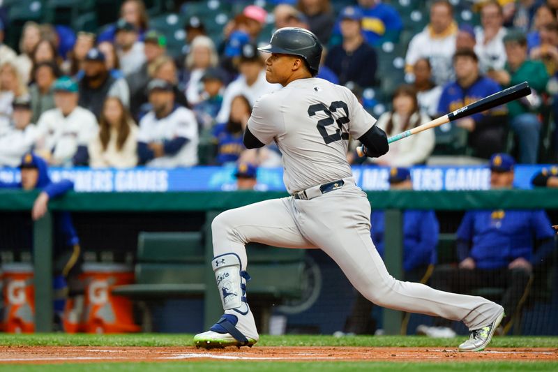 Sep 17, 2024; Seattle, Washington, USA; New York Yankees right fielder Juan Soto (22) hits a double against the Seattle Mariners during the first inning at T-Mobile Park. Mandatory Credit: Joe Nicholson-Imagn Images