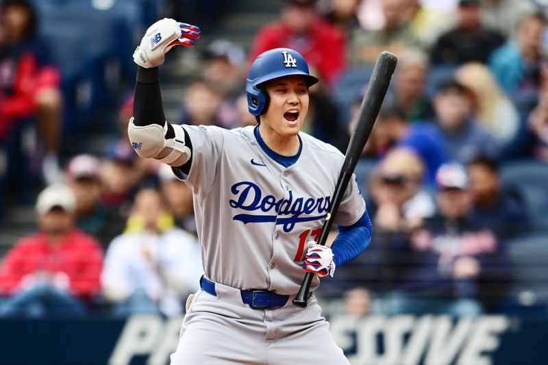 May 28, 2025; Cleveland, Ohio, USA; Los Angeles Dodgers designated hitter Shohei Ohtani (17) motions for Los Angeles Dodgers first baseman Kike Hernandez (not pictured) to come home on a wild pitch during the seventh inning against the Cleveland Guardians at Progressive Field. Mandatory Credit: Ken Blaze-Imagn Images