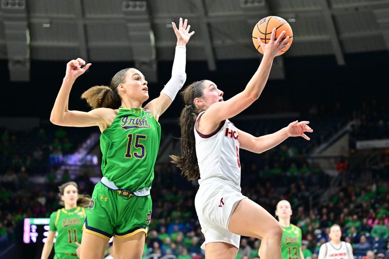 Feb 29, 2024; South Bend, Indiana, USA; Virginia Tech Hokies guard Georgia Amoore (5) goes up for a shot as Notre Dame Fighting Irish forward Nat Marshall (15) defends in the first half at the Purcell Pavilion. Mandatory Credit: Matt Cashore-USA TODAY Sports