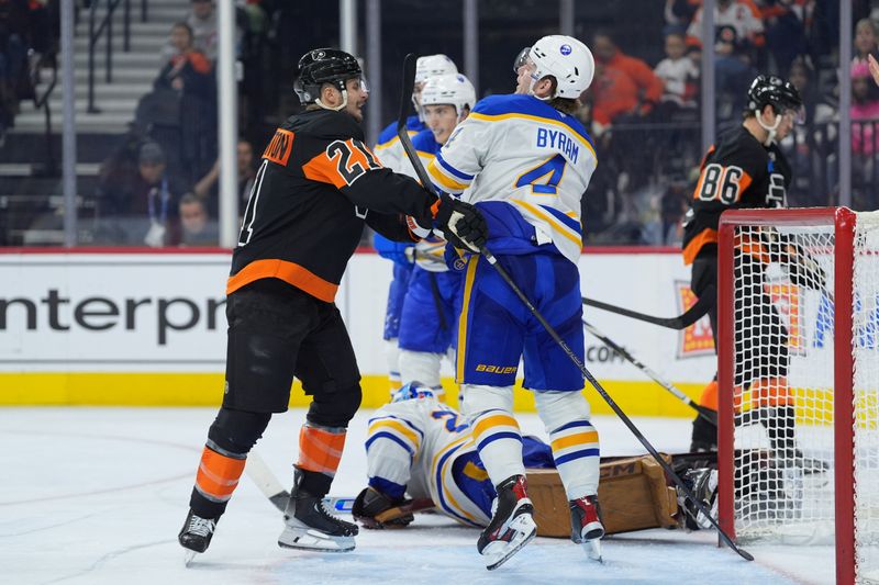 Nov 16, 2024; Philadelphia, Pennsylvania, USA; Philadelphia Flyers center Scott Laughton (21) hits Buffalo Sabres defenseman Bowen Byram (4) in the third period at Wells Fargo Center. Mandatory Credit: Kyle Ross-Imagn Images