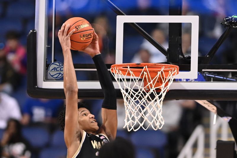 Mar 8, 2023; Greensboro, NC, USA; Wake Forest Demon Deacons forward Bobi Klintman (34) scores in the second half of the second round at Greensboro Coliseum. Mandatory Credit: Bob Donnan-USA TODAY Sports