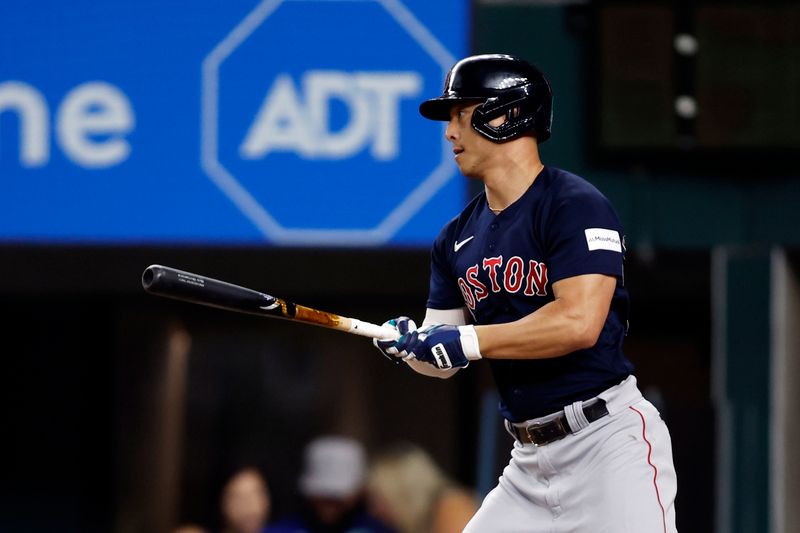 Sep 18, 2023; Arlington, Texas, USA; Boston Red Sox left fielder Rob Refsnyder (30) hits a two run single in the eighth inning against the Texas Rangers at Globe Life Field. Mandatory Credit: Tim Heitman-USA TODAY Sports