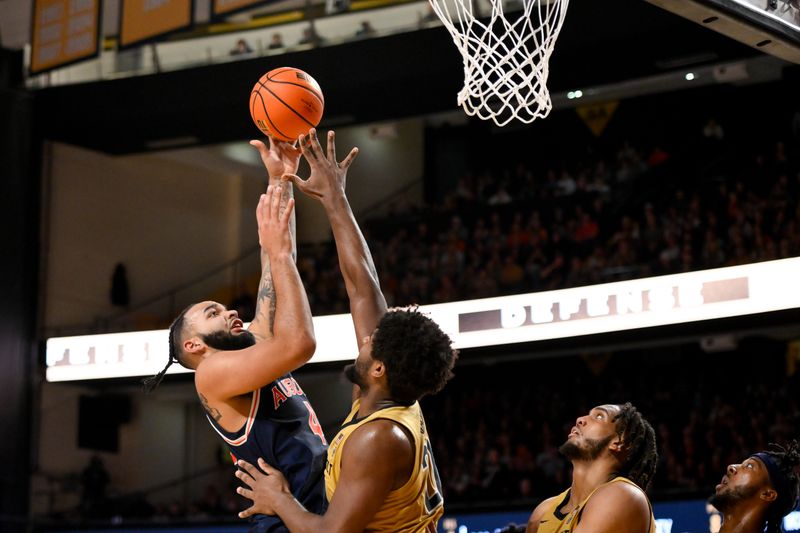 Feb 11, 2025; Nashville, Tennessee, USA; Vanderbilt Commodores guard Grant Huffman (4) shoots over Vanderbilt Commodores forward Jaylen Carey (22) during the second half at Memorial Gymnasium. Mandatory Credit: Steve Roberts-Imagn Images