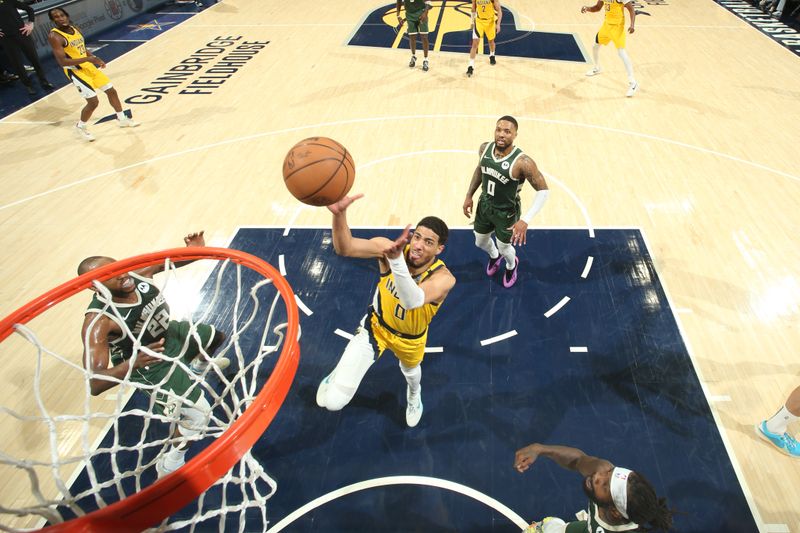 INDIANAPOLIS, IN - APRIL 26: Tyrese Haliburton #0 of the Indiana Pacers drives to the basket during the game against the Milwaukee Bucks during Round 1 Game 3 of the 2024 NBA Playoffs on April 26, 2024 at Gainbridge Fieldhouse in Indianapolis, Indiana. NOTE TO USER: User expressly acknowledges and agrees that, by downloading and or using this Photograph, user is consenting to the terms and conditions of the Getty Images License Agreement. Mandatory Copyright Notice: Copyright 2023 NBAE (Photo by Nathaniel S. Butler/NBAE via Getty Images)