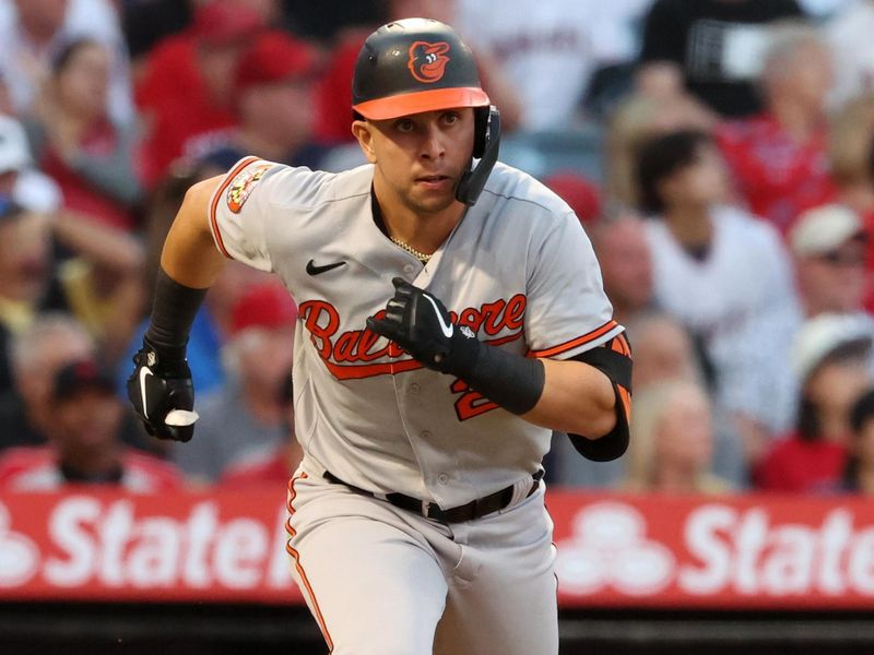 Sep 6, 2023; Anaheim, California, USA;  Baltimore Orioles second baseman Ramon Urias (29) hits an RBI single during the second inning against the Los Angeles Angels at Angel Stadium. Mandatory Credit: Kiyoshi Mio-USA TODAY Sports