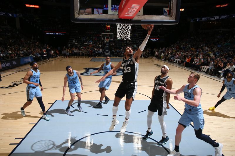 MEMPHIS, TN - APRIL 9: Tre Jones #33 of the San Antonio Spurs drives to the basket during the game against the Memphis Grizzlies  on April 9, 2024 at FedExForum in Memphis, Tennessee. NOTE TO USER: User expressly acknowledges and agrees that, by downloading and or using this photograph, User is consenting to the terms and conditions of the Getty Images License Agreement. Mandatory Copyright Notice: Copyright 2024 NBAE (Photo by Joe Murphy/NBAE via Getty Images)