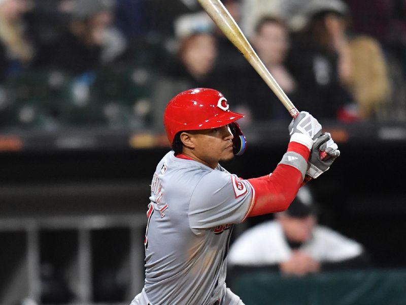 Apr 12, 2024; Chicago, Illinois, USA; Cincinnati Reds third base Santiago Espinal (4) hits a two-run single during the ninth inning against the Chicago White Sox at Guaranteed Rate Field. Mandatory Credit: Patrick Gorski-USA TODAY Sports