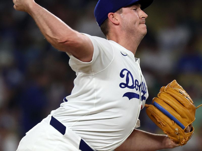 Jul 5, 2024; Los Angeles, California, USA;  Los Angeles Dodgers relief pitcher Evan Phillips (59) pitches during the ninth inning against the Milwaukee Brewers at Dodger Stadium. Mandatory Credit: Kiyoshi Mio-USA TODAY Sports