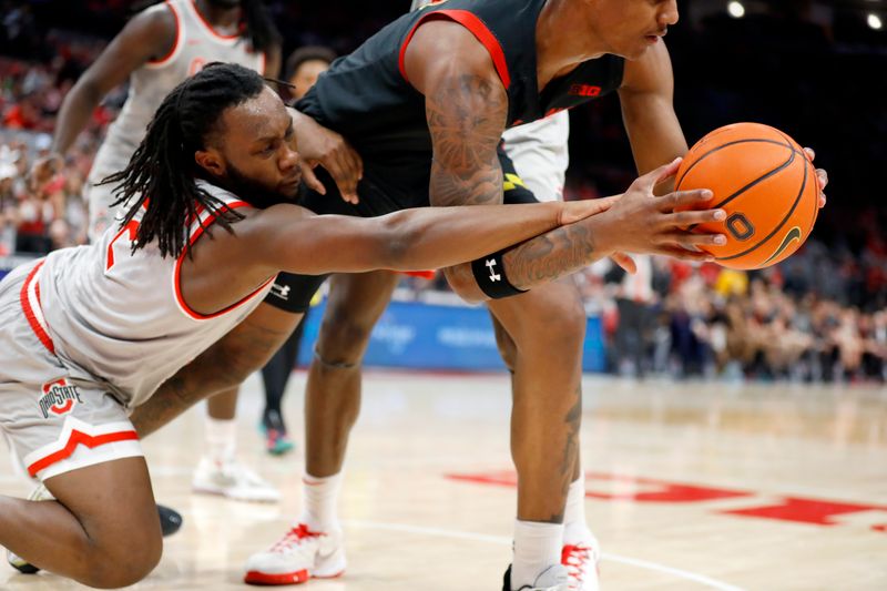 Mar 1, 2023; Columbus, Ohio, USA;  Ohio State Buckeyes guard Bruce Thornton (2) attempts the steal from Maryland Terrapins forward Julian Reese (10) as during the first half at Value City Arena. Mandatory Credit: Joseph Maiorana-USA TODAY Sports