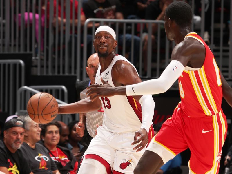 MIAMI, FL - OCTOBER 16: Bam Adebayo #13 of the Miami Heat looks to pass the ball during the game against the Atlanta Hawks on October 16, 2024 at Miami-Dade Arena in Miami, Florida. NOTE TO USER: User expressly acknowledges and agrees that, by downloading and or using this Photograph, user is consenting to the terms and conditions of the Getty Images License Agreement. Mandatory Copyright Notice: Copyright 2024 NBAE (Photo by Issac Baldizon/NBAE via Getty Images)