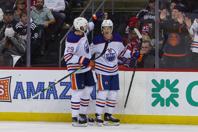 Dec 21, 2023; Newark, New Jersey, USA; Edmonton Oilers center Ryan McLeod (71) celebrates his goal against the New Jersey Devils during the third period at Prudential Center. Mandatory Credit: Ed Mulholland-USA TODAY Sports