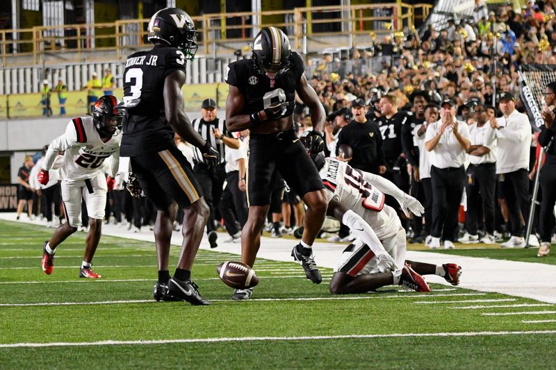 Oct 19, 2024; Nashville, Tennessee, USA;  Vanderbilt Commodores wide receiver Junior Sherrill (0) celebrates the first down against the Ball State Cardinals during the first half at FirstBank Stadium. Mandatory Credit: Steve Roberts-Imagn Images