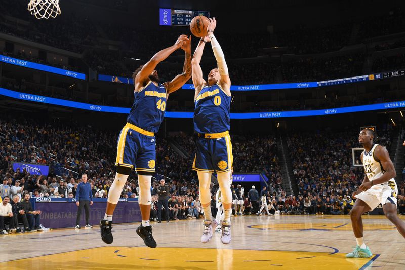 SAN FRANCISCO, CA - DECEMBER 5: Donte DiVincenzo #0 of the Golden State Warriors grabs the rebound during the game against the Indiana Pacers on December 5, 2022 at Chase Center in San Francisco, California. NOTE TO USER: User expressly acknowledges and agrees that, by downloading and or using this photograph, user is consenting to the terms and conditions of Getty Images License Agreement. Mandatory Copyright Notice: Copyright 2022 NBAE (Photo by Noah Graham/NBAE via Getty Images)