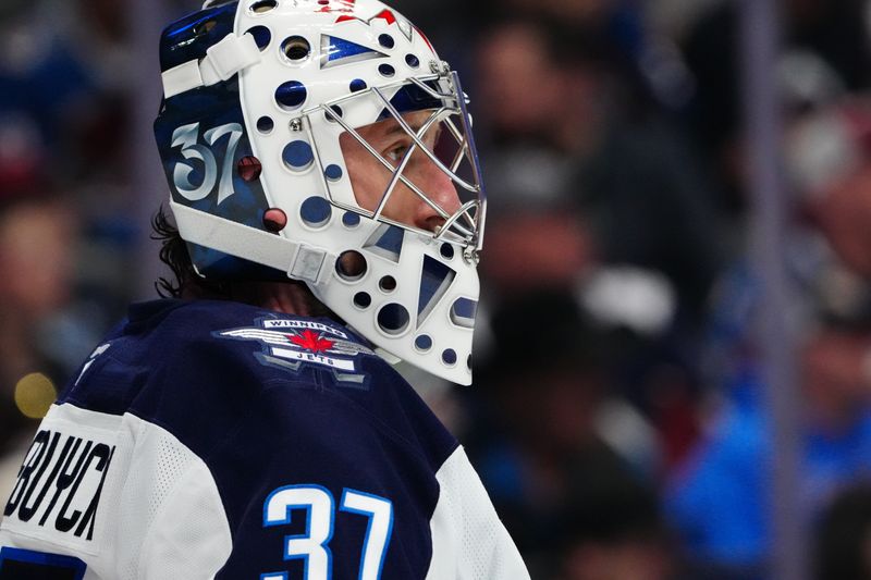 Mar 28, 2026; Denver, Colorado, USA; Winnipeg Jets goaltender Connor Hellebuyck (37) looks on during the second period against the Colorado Avalanche at Ball Arena. Mandatory Credit: Ron Chenoy-Imagn Images
