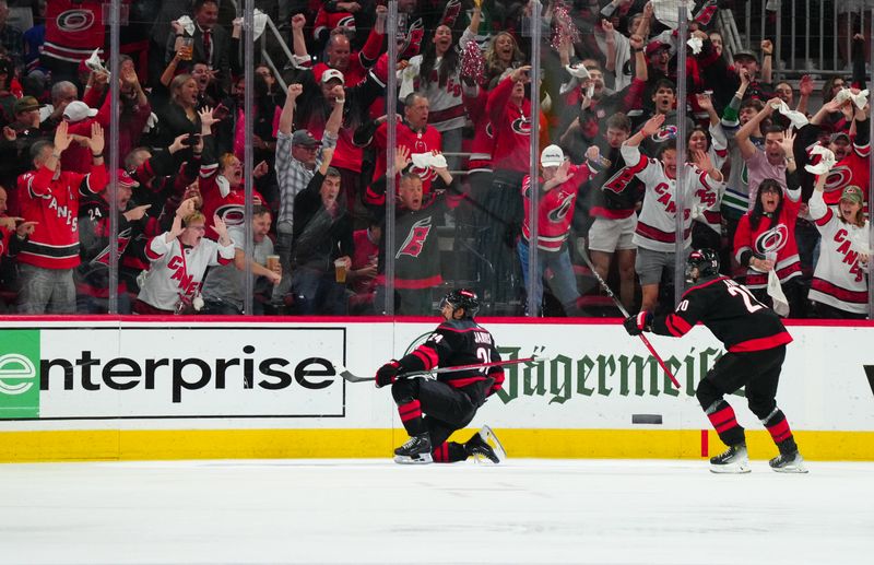 May 16, 2024; Raleigh, North Carolina, USA; Carolina Hurricanes center Seth Jarvis (24) scores a goal against the New York Rangers during the second period in game six of the second round of the 2024 Stanley Cup Playoffs at PNC Arena. Mandatory Credit: James Guillory-USA TODAY Sports