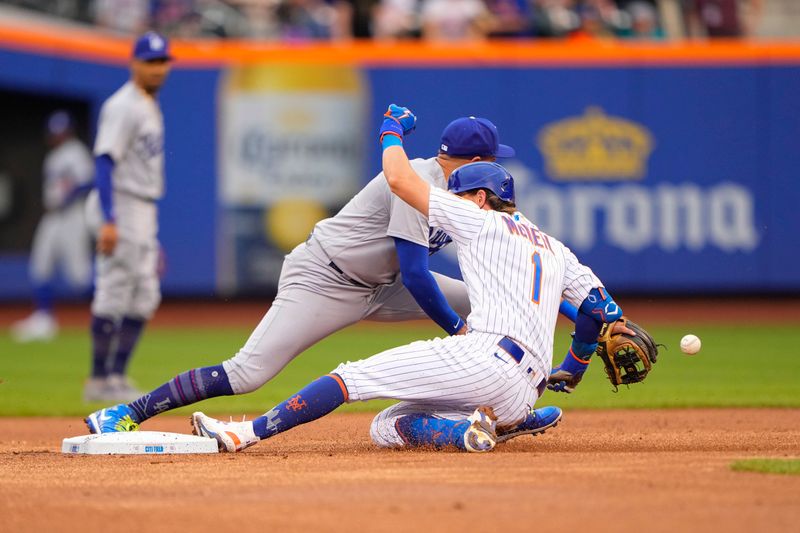 Jul 16, 2023; New York City, New York, USA;  New York Mets second baseman Jeff McNeil (1) slides safely into second base with a double with Los Angeles Dodgers shortstop Miguel Rojas (11) receiving the throw during the first inning at Citi Field. Mandatory Credit: Gregory Fisher-USA TODAY Sports