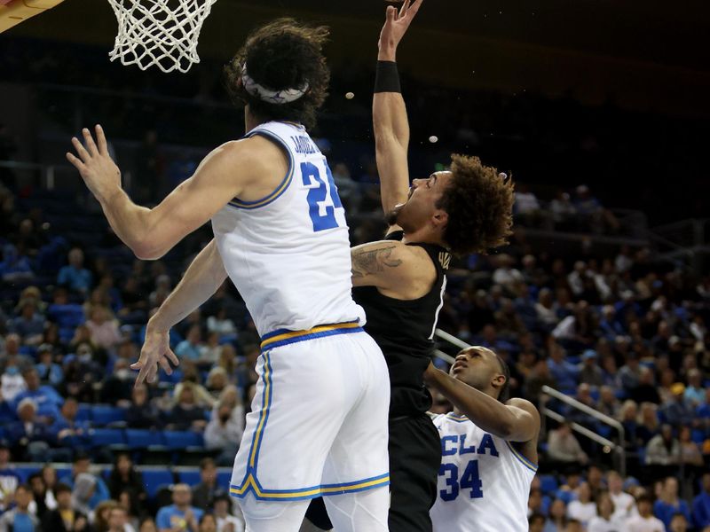 Jan 14, 2023; Los Angeles, California, USA;  Colorado Buffaloes guard J'Vonne Hadley (13) shoots the ball against UCLA Bruins guard Jaime Jaquez Jr. (24) during the first half at Pauley Pavilion presented by Wescom. Mandatory Credit: Kiyoshi Mio-USA TODAY Sports