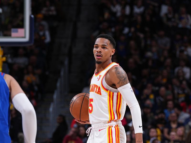 DENVER, CO - APRIL 6: Dejounte Murray #5 of the Atlanta Hawks dribbles the ball during the game against the Denver Nuggets on April 6, 2024 at the Ball Arena in Denver, Colorado. NOTE TO USER: User expressly acknowledges and agrees that, by downloading and/or using this Photograph, user is consenting to the terms and conditions of the Getty Images License Agreement. Mandatory Copyright Notice: Copyright 2024 NBAE (Photo by Garrett Ellwood/NBAE via Getty Images)