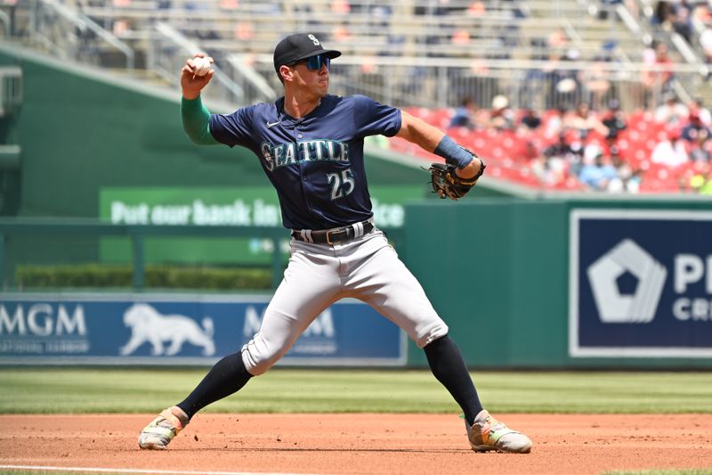 May 26, 2024; Washington, District of Columbia, USA; Seattle Mariners third baseman Dylan Moore (25) prepares to throw the ball to first base against the Washington Nationals during the first inning  at Nationals Park. Mandatory Credit: Rafael Suanes-USA TODAY Sports