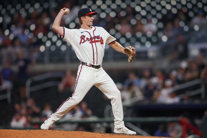 Aug 6, 2024; Atlanta, Georgia, USA; Atlanta Braves center fielder Luke Williams (65) pitches against the Milwaukee Brewers in the ninth inning at Truist Park. Mandatory Credit: Brett Davis-USA TODAY Sports
