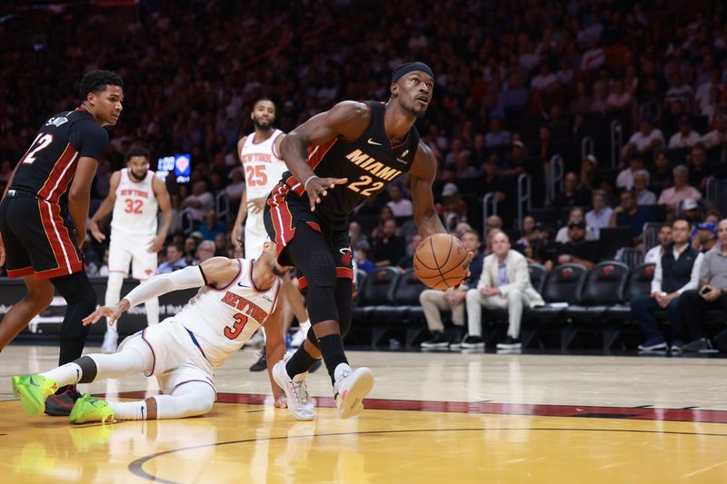 MIAMI, FLORIDA - OCTOBER 30: Jimmy Butler #22 of the Miami Heat drives to the basket ahead of Miles McBride #2 of the New York Knicks during the second half at Kaseya Center on October 30, 2024 in Miami, Florida. NOTE TO USER: User expressly acknowledges and agrees that, by downloading and or using this photograph, User is consenting to the terms and conditions of the Getty Images License Agreement. (Photo by Carmen Mandato/Getty Images)