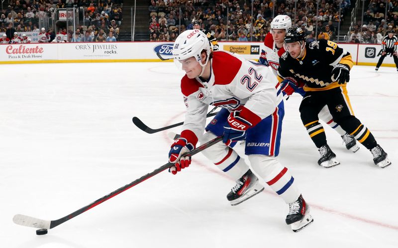 Feb 22, 2024; Pittsburgh, Pennsylvania, USA; Montreal Canadiens right wing Cole Caufield (22) moves the puck against Pittsburgh Penguins right wing Reilly Smith (19) during the second period at PPG Paints Arena. Mandatory Credit: Charles LeClaire-USA TODAY Sports